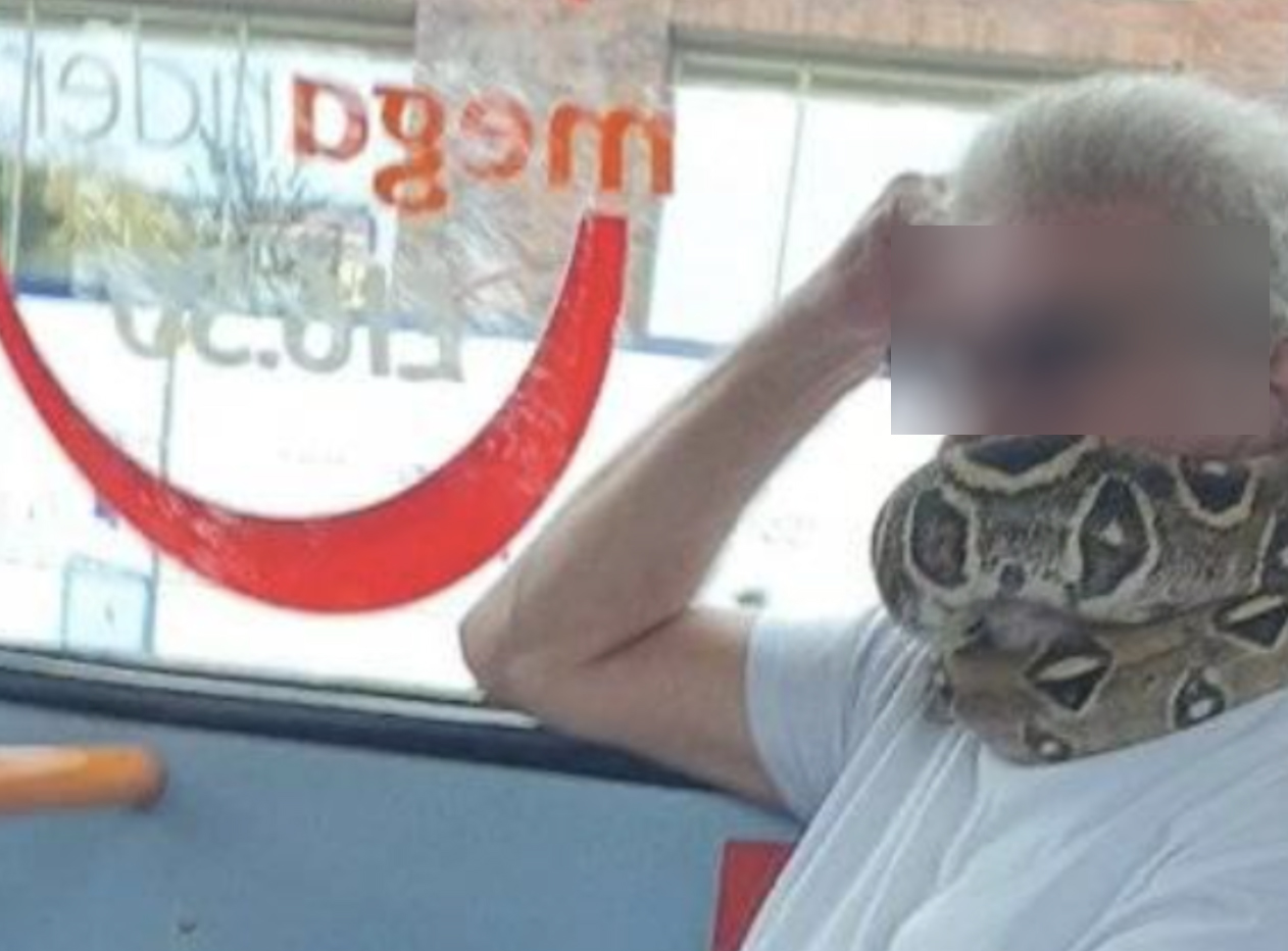 A man has been spotted using a snake as a face covering on a bus in Salford, The Manc