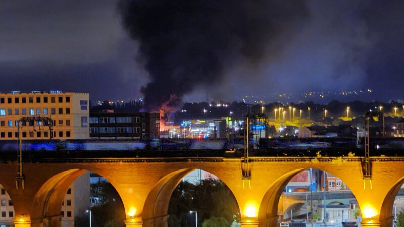 A huge blaze has broken out at Stockport Jaguar and Land Rover car dealership, The Manc