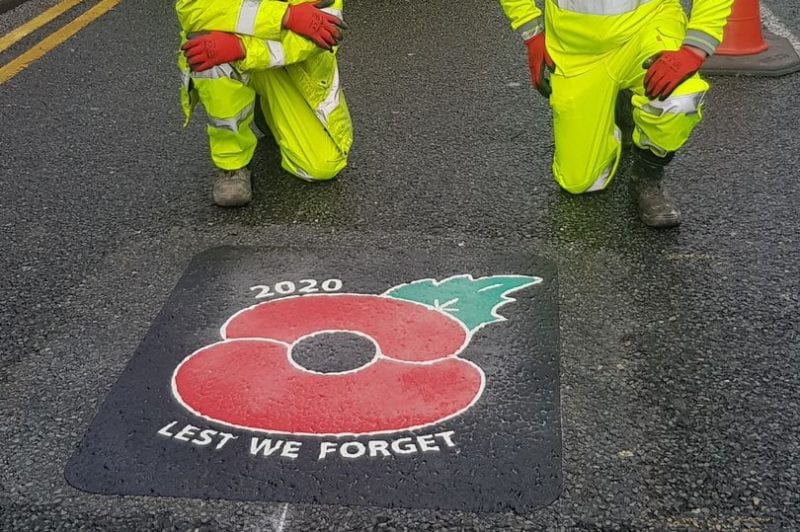 ‘Lest We Forget’ poppy road signs are being painted near war memorials across Bolton, The Manc