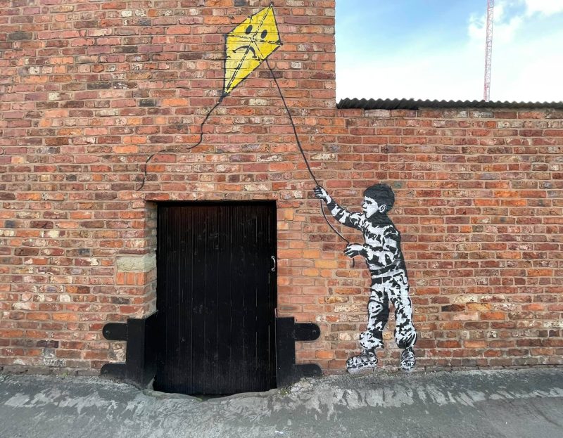 New Banksy-style street art mural appears on the side of a Stockport pub, The Manc