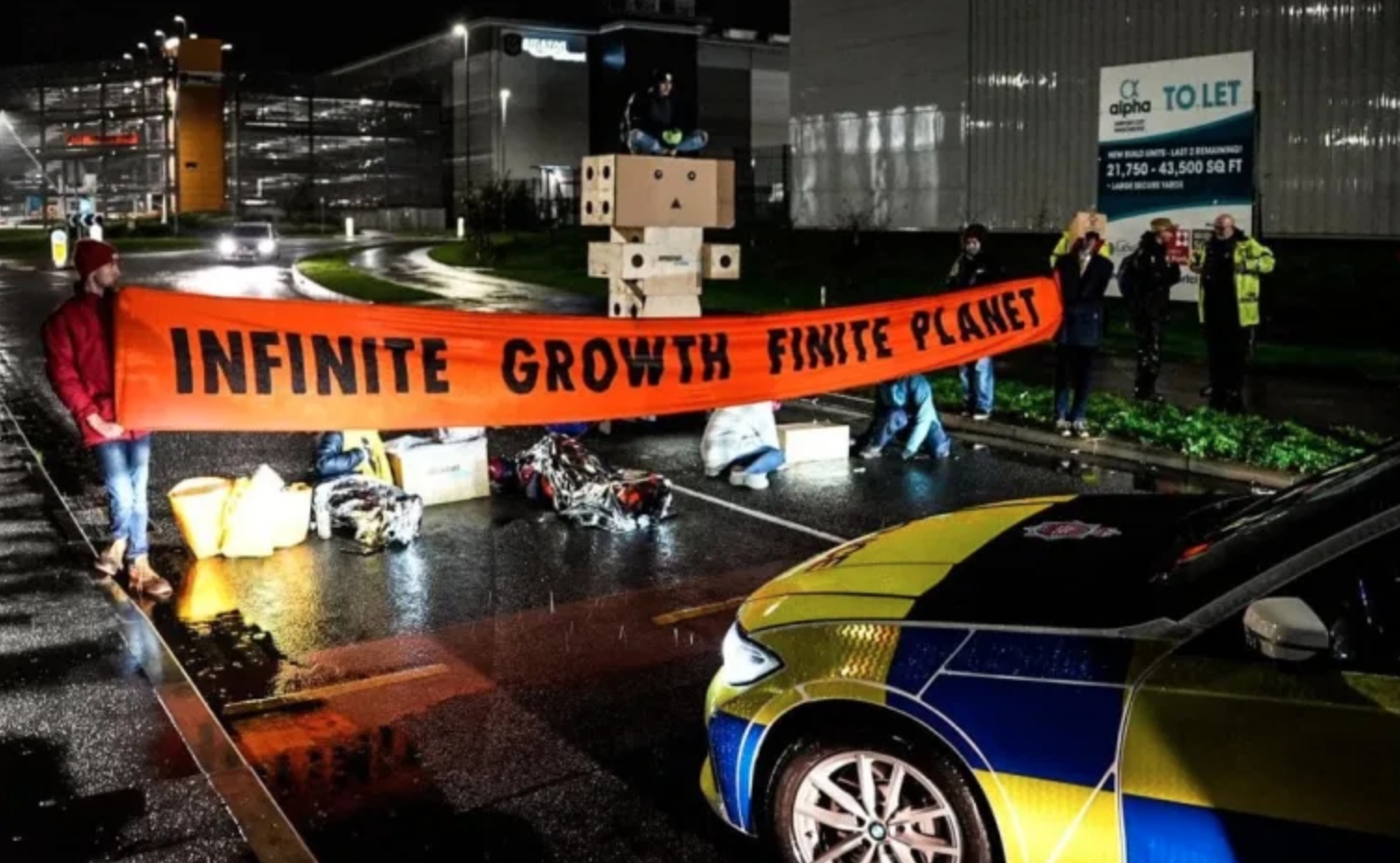 Extinction Rebellion block Amazon warehouse in Manchester for Black Friday protests, The Manc