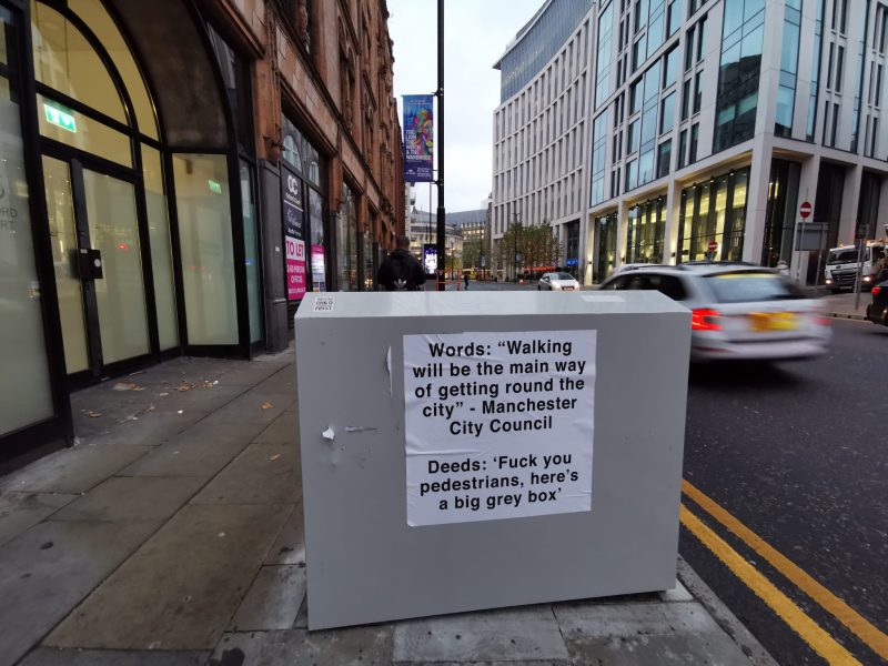 Someone has plastered &#8216;f*** you&#8217; posters on Manchester&#8217;s pavement-blocking grey boxes, The Manc