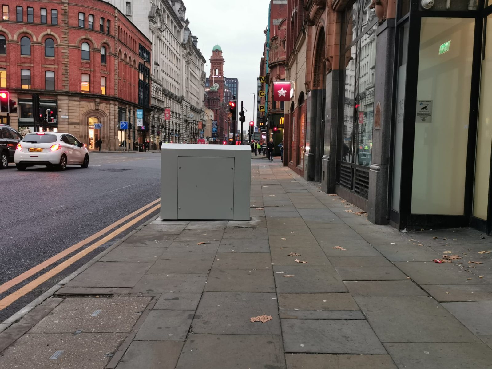 Someone has plastered &#8216;f*** you&#8217; posters on Manchester&#8217;s pavement-blocking grey boxes, The Manc