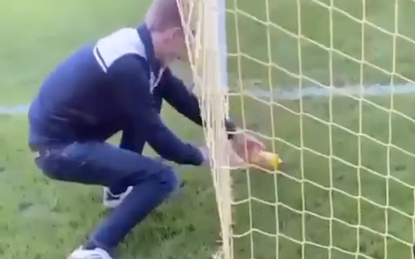 Fan urinates in Warrington Town keeper bottle