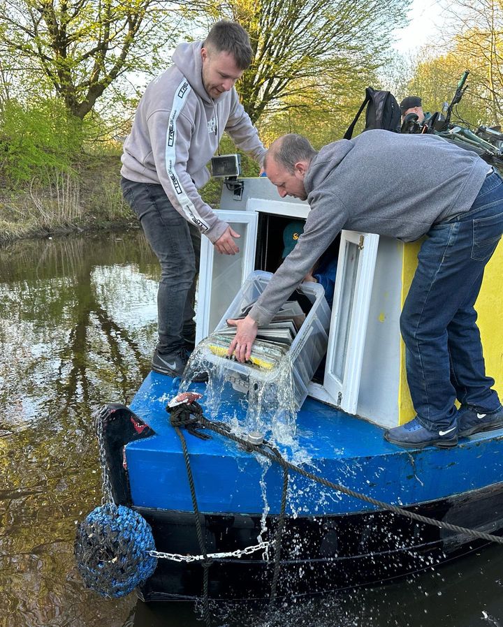 Water pouring out of a box of records after Rubber Ducky Records sank