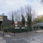 A woman has died after being hit by a train at Gatley