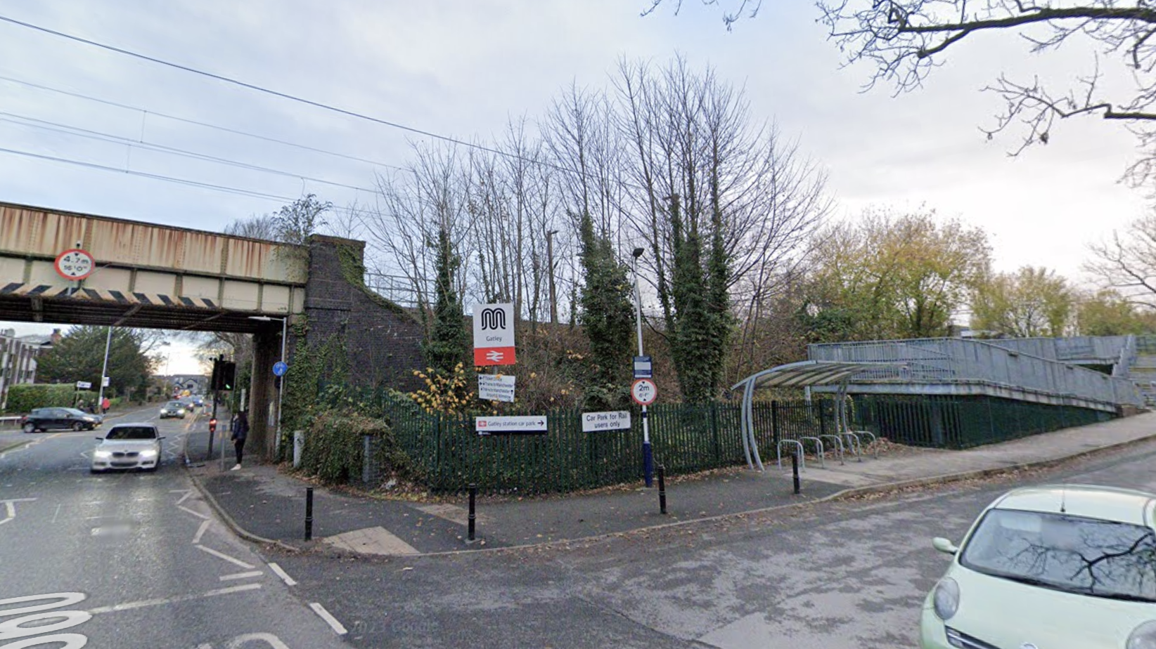 A woman has died after being hit by a train at Gatley