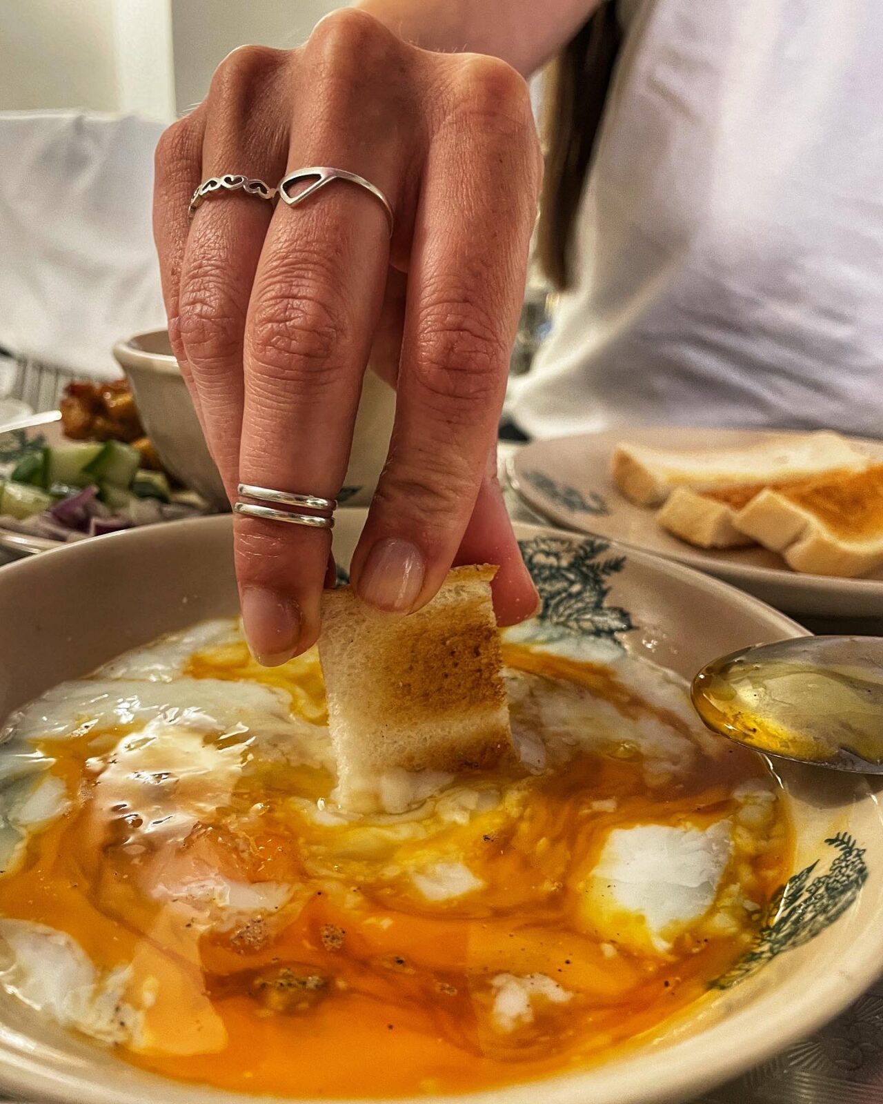 Toast strips dipped into half boiled eggs