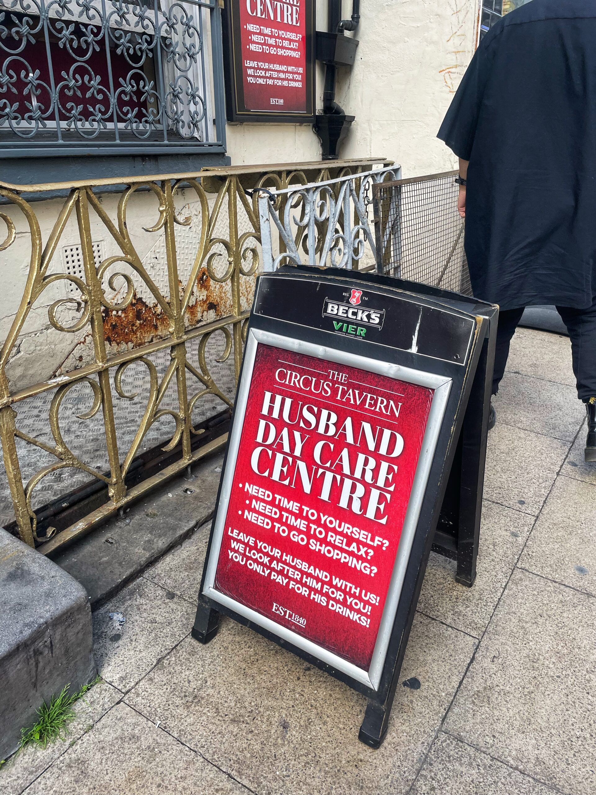 a pub sign advertising a husband creche