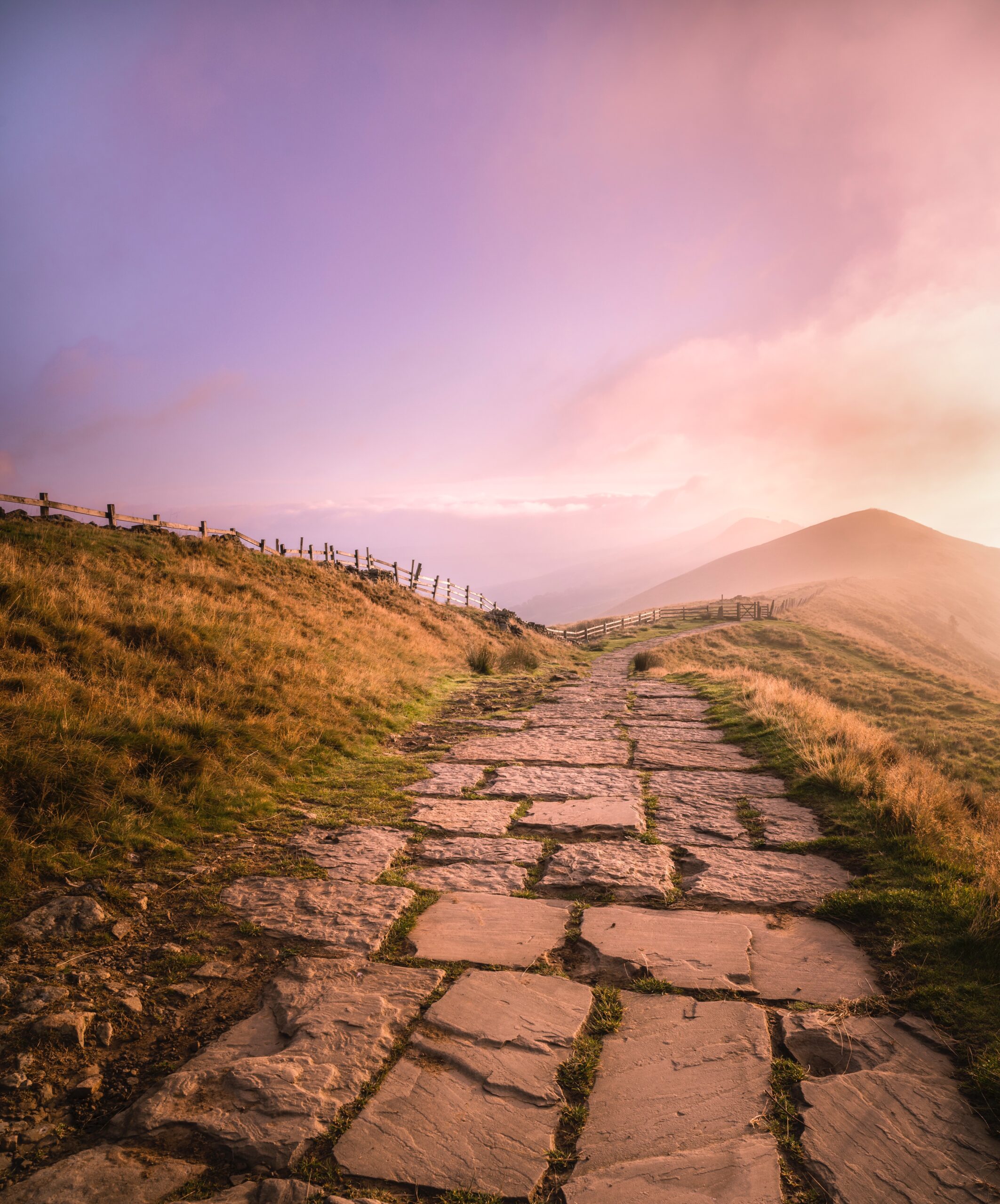 The paved footpath at sunrise along The Great Ridge in the Peak District, which has been named one of Britain's most popular walks