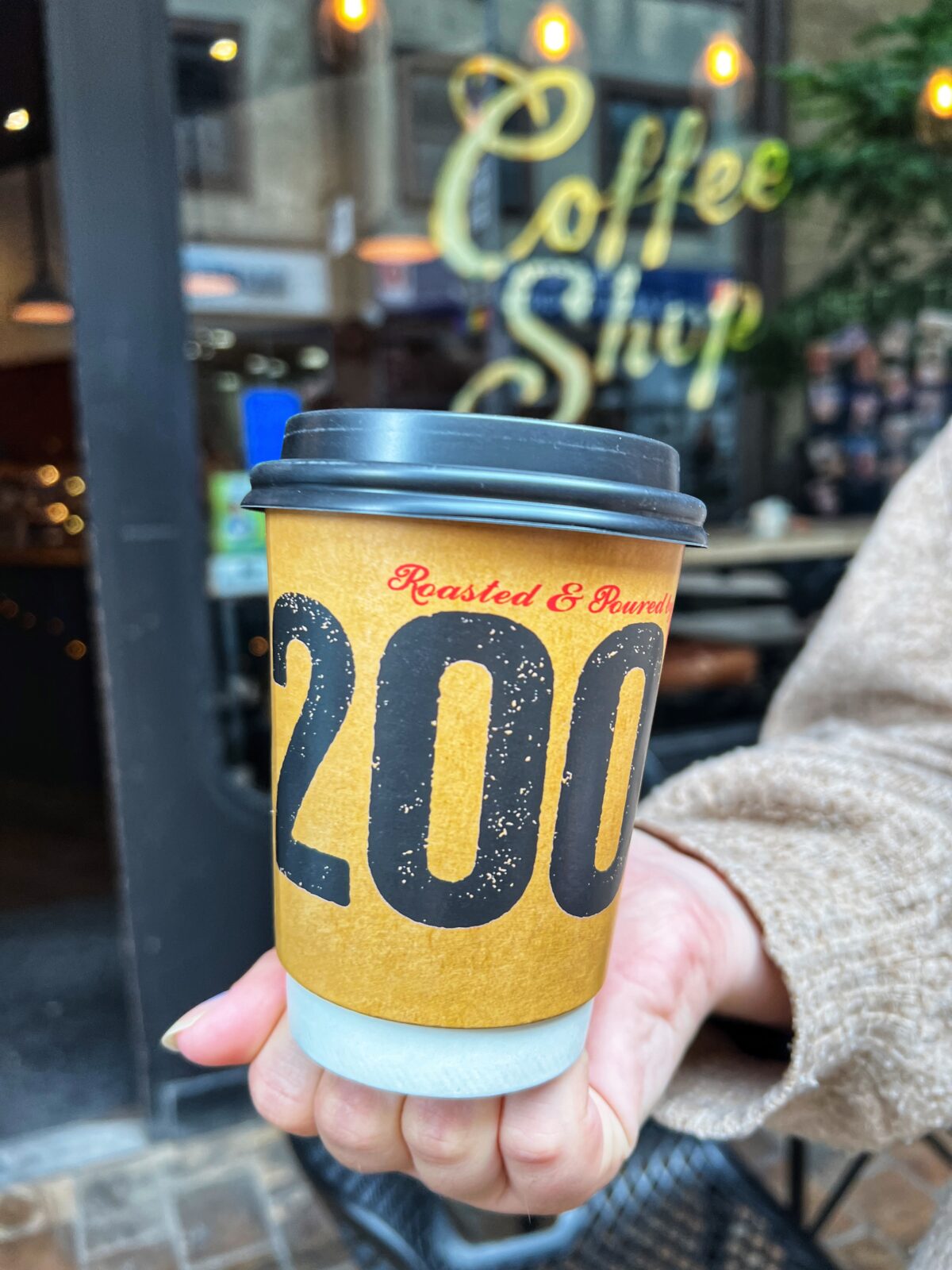 coffee cup with 200 written on it.