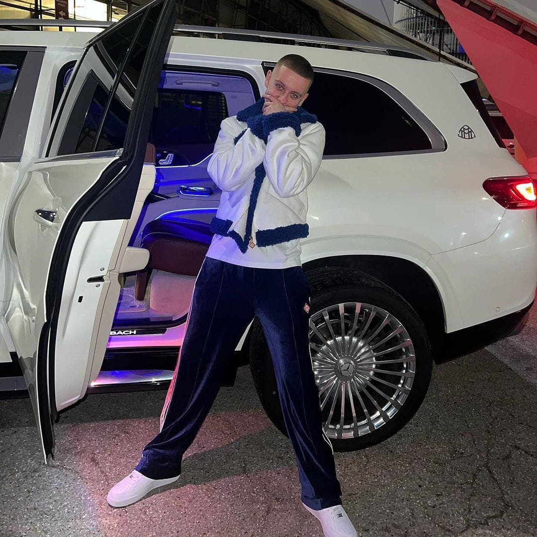 Aitch posing with his luxury Mercedes Maybach car before the attempted break-in
