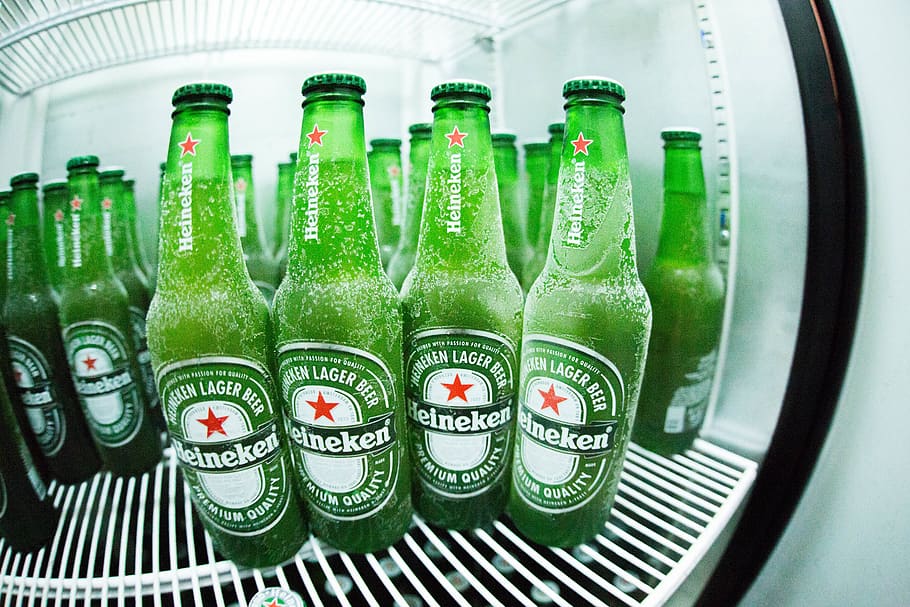 A fridge full of cold bottles of Heineken beer