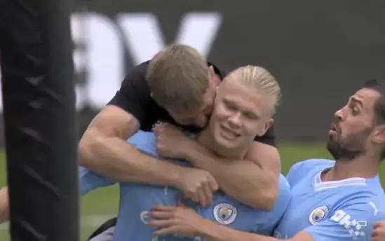 Manchester City fan gives Erling Haaland a flying hug