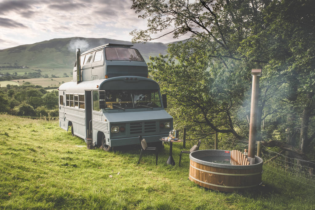 This Lake District staycation is made of a VW campervan and a school bus stacked on top of each other. Credit: Canopy & StarsThis Lake District staycation is made of a VW campervan and a school bus stacked on top of each other. Credit: Canopy & Stars