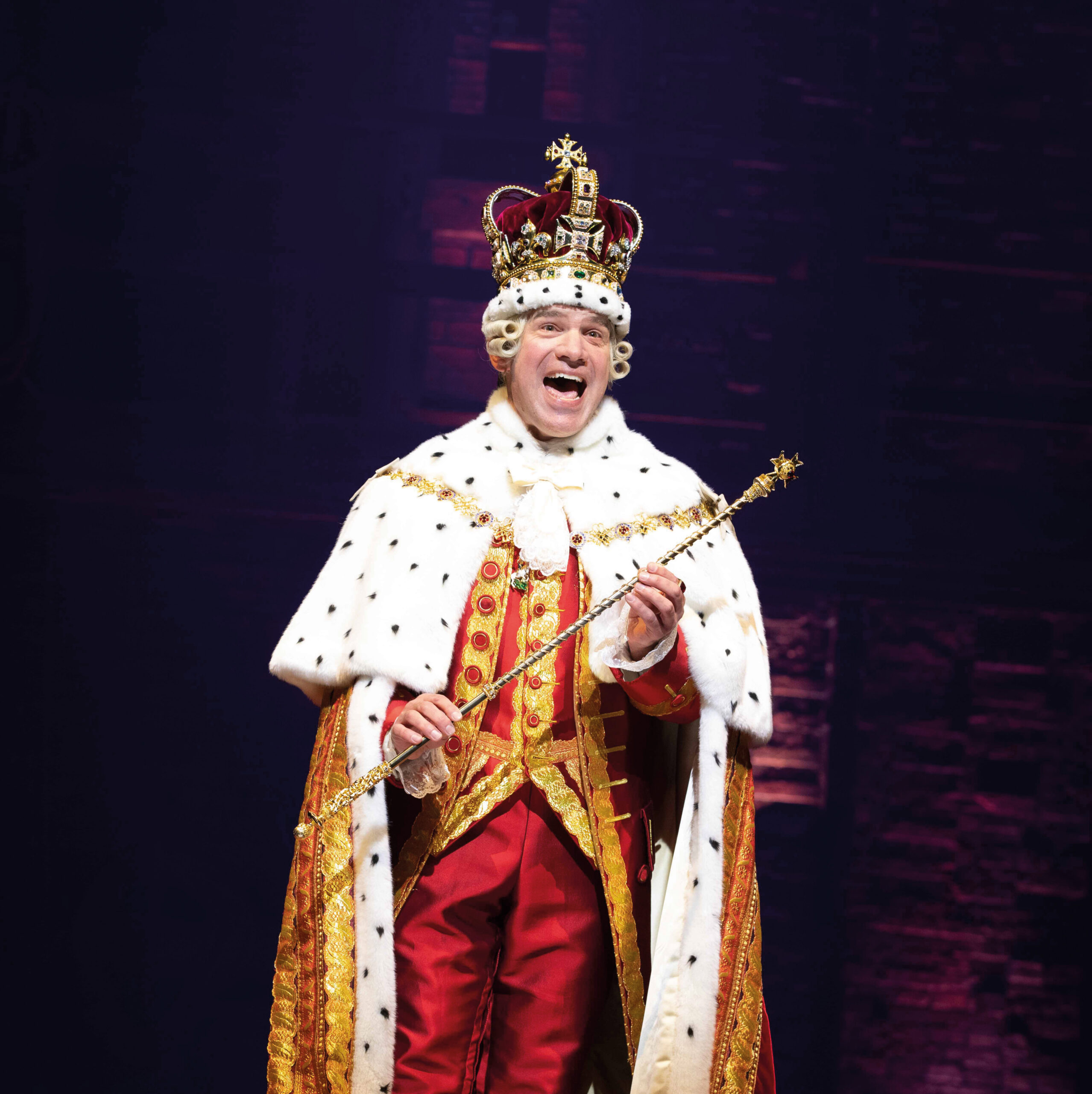 Daniel Boys as King George in Hamilton, which is in Manchester until 2024. Credit: Danny Kaan