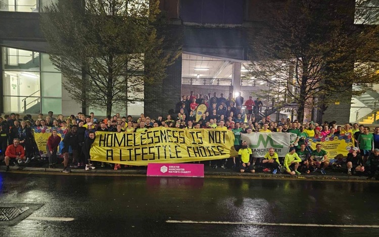 Manchester runners protest banner on Suella Braverman's homeless comments