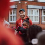 Christian Eriksen makes surprise visit to Old Trafford primary school