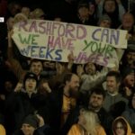Newport County fans hold up sign asking for Marcus Rashford's wages after night out in Belfast