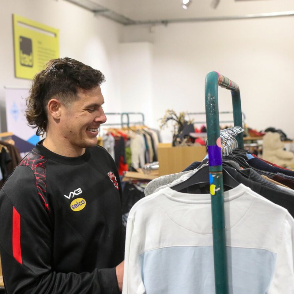 salford rugby donate kits and sports gear to local charity shop