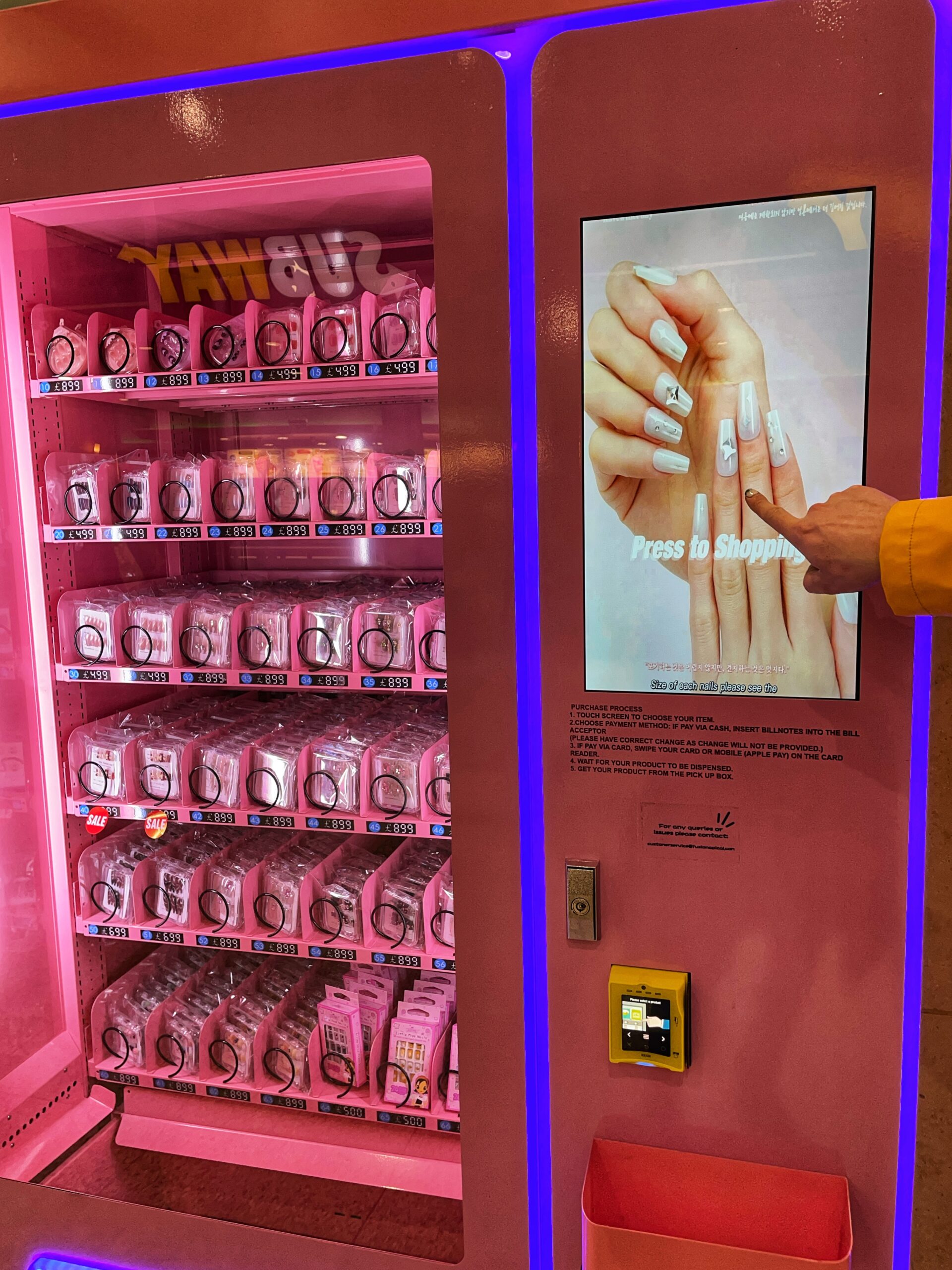 And a false nails vending machine next to it