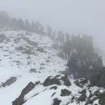 Queues of people at the summit of Snowdon