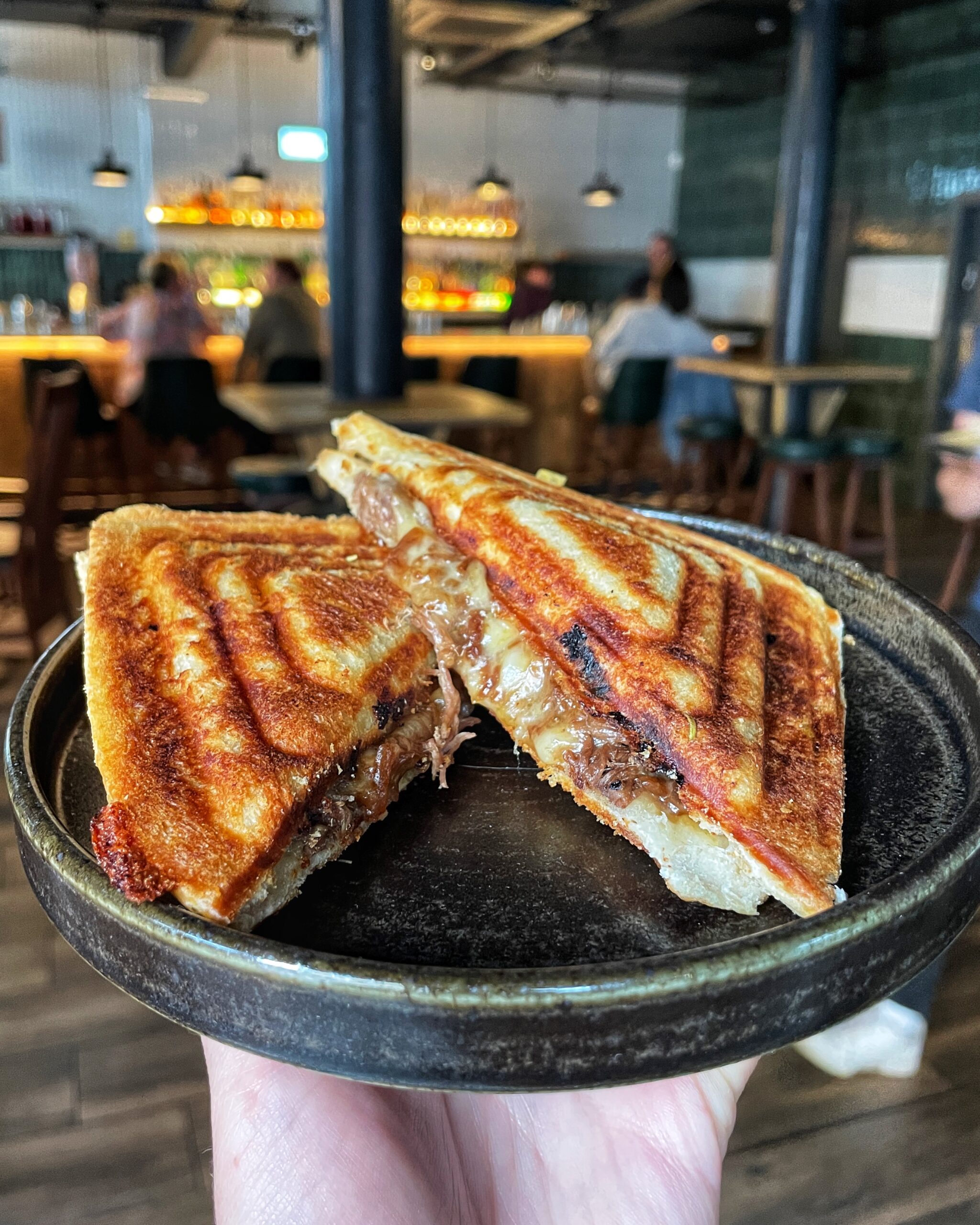 A braised beef and red onion toastie at Blinker in Manchester
