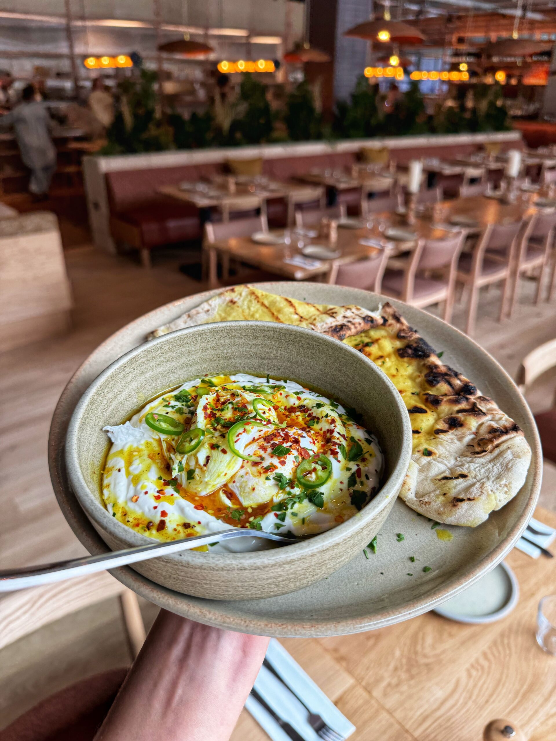 Poached eggs and whipped yoghurt with flatbread