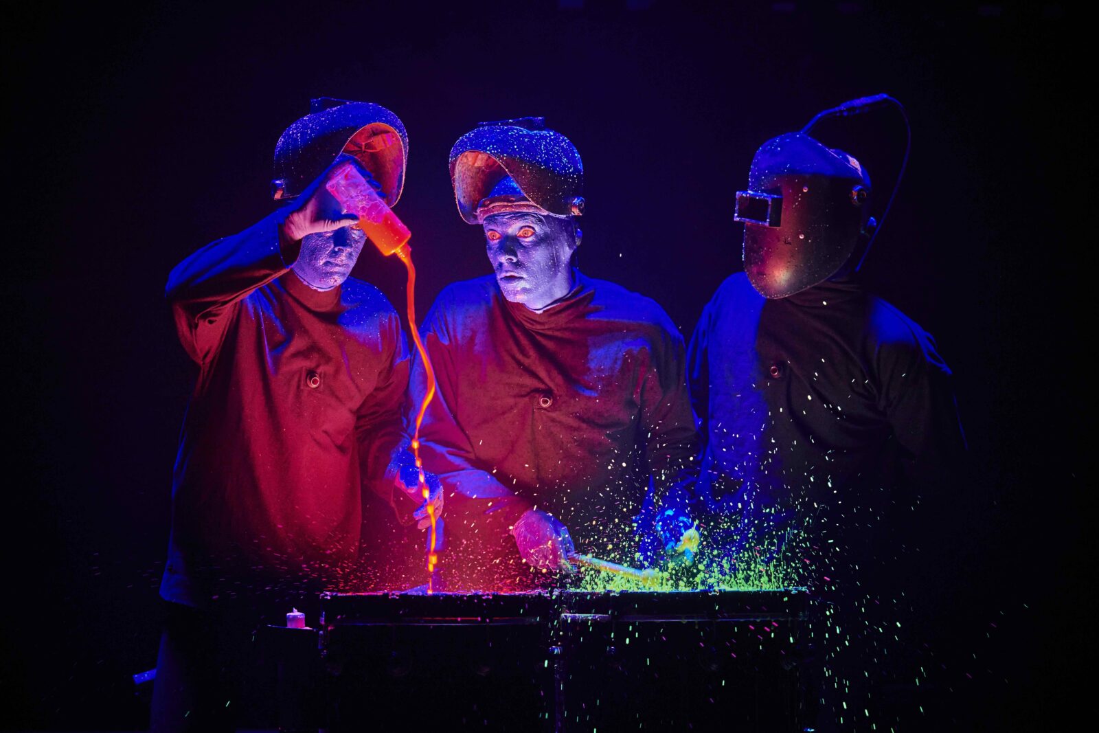 UV paint and a set of drums are an iconic Blue Man Group stunt. Credit: Supplied