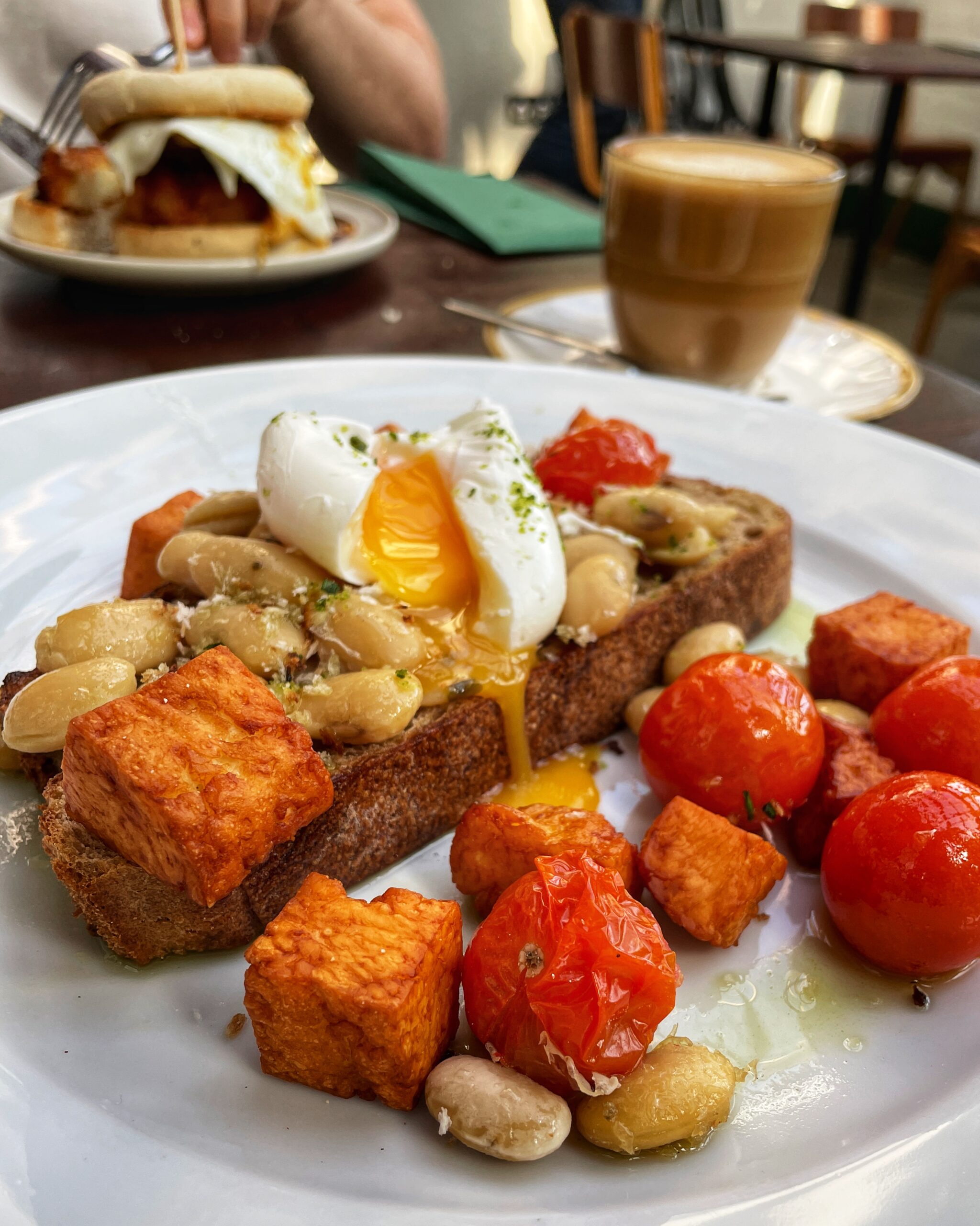 Halloumi, confit tomatoes and pesto butter beans on toast. Credit: The Manc Group