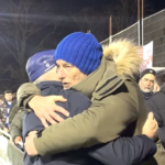 Oldham Athletic owner shaking away fans hands before Christmas