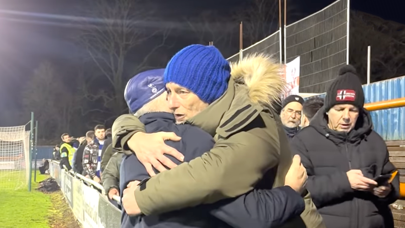 Oldham Athletic owner shaking away fans hands before Christmas