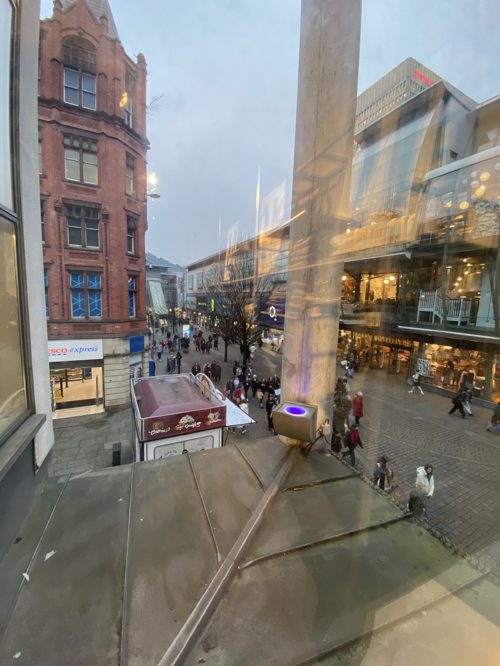 A shop window looking out onto Market Street 