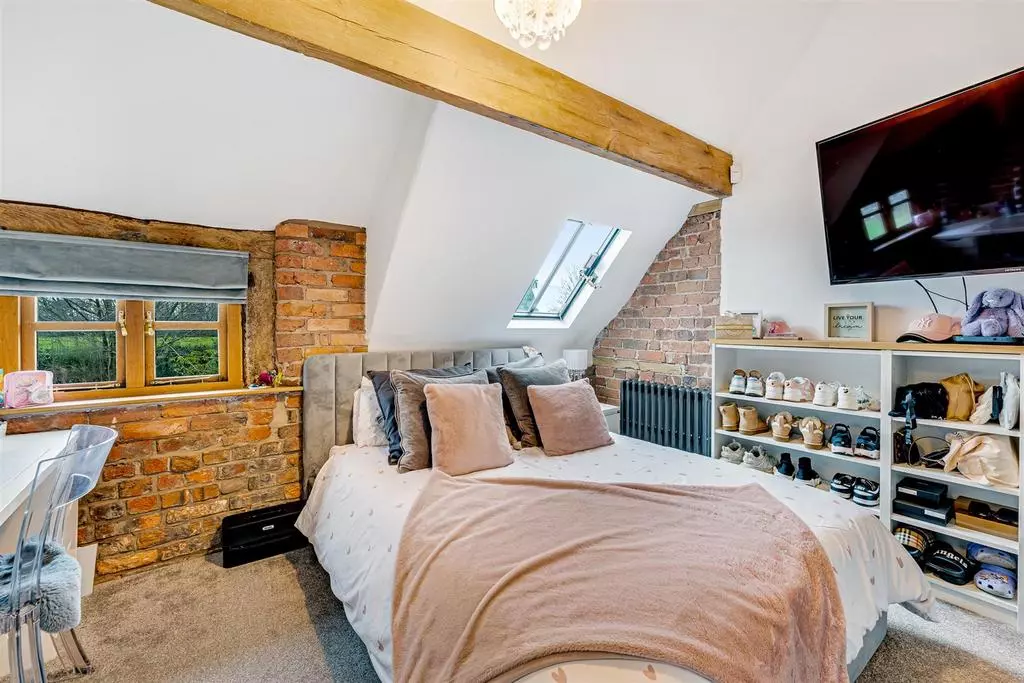 All the bedrooms have their own wooden beams which helps keep the barn character alive throughout the property.