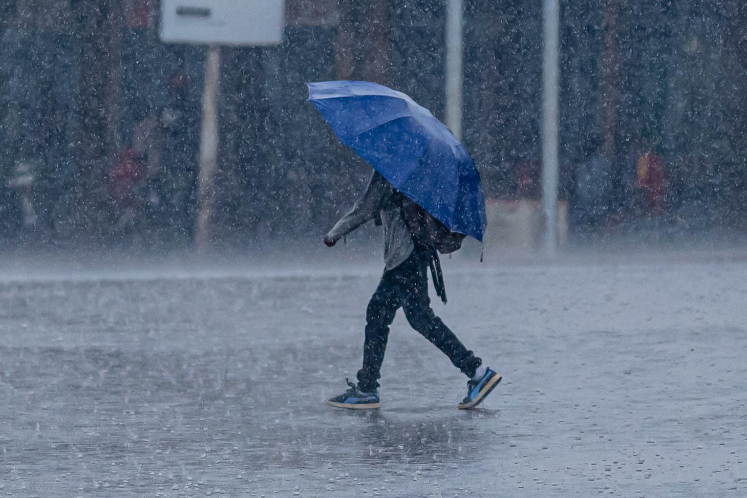 Man walking in rain