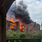 Smoke billows across Manchester city centre as historic mill goes up in flames