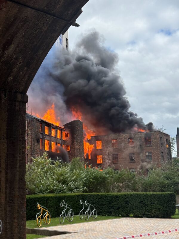 Smoke billows across Manchester city centre as historic mill goes up in flames
