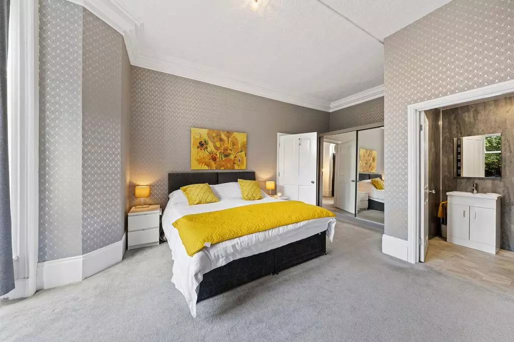 The grand staircase and one of ten bedrooms inside this Victorian mansion near Greater Manchester  / Credit: On The Market