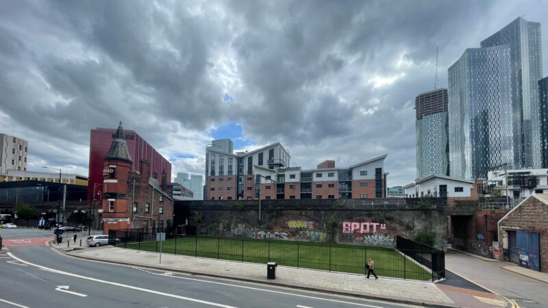 Fenced off green space Manchester city centre gated lawn