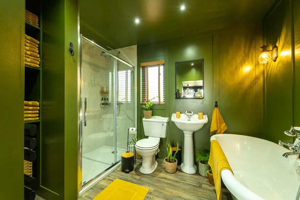 The living area and bathroom at Hous Viridis, where you can stay in a converted shipping container / Credit: Hous Viridis