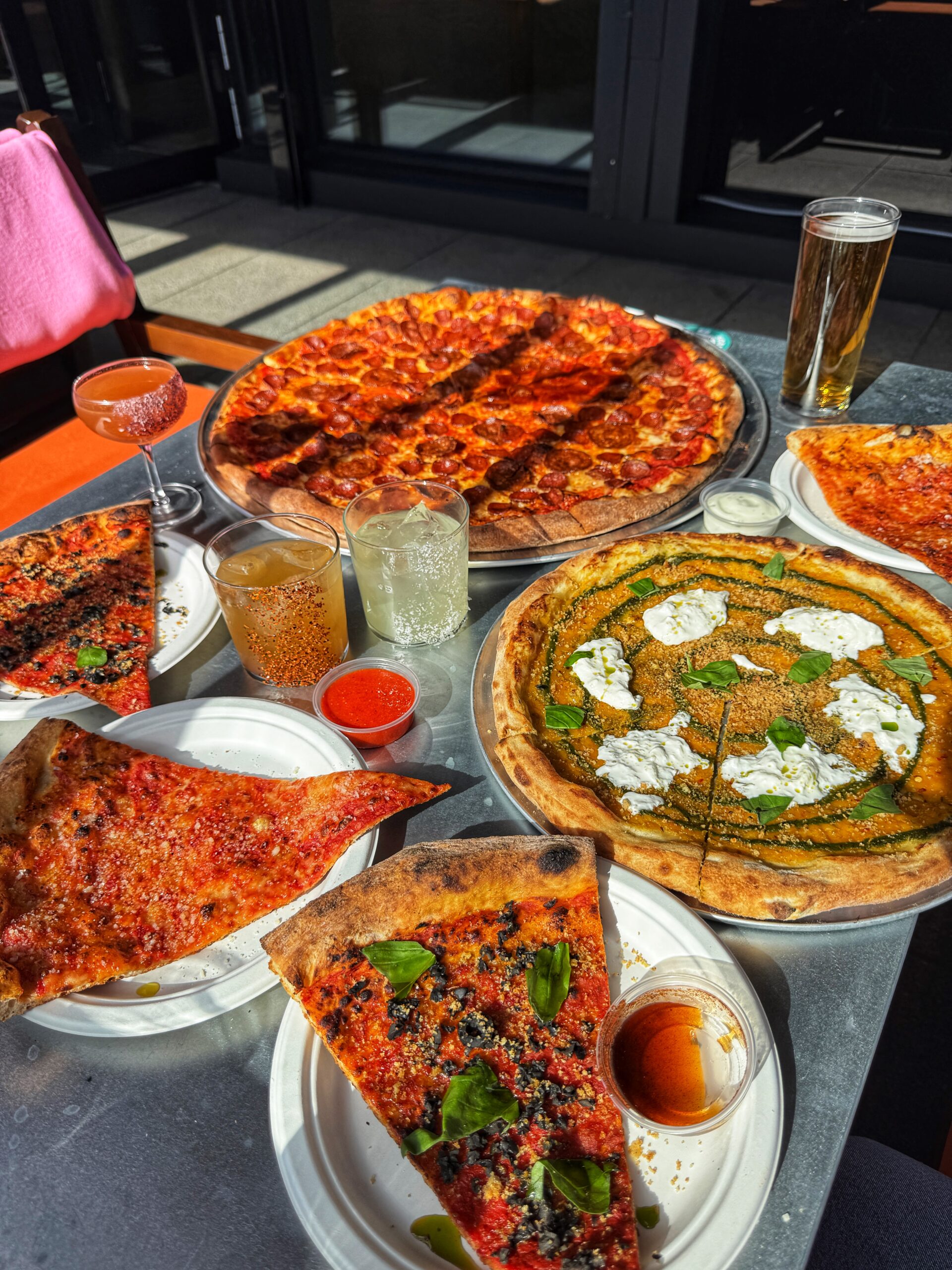 A spread of pizzas and cocktails at Nell's MediaCity