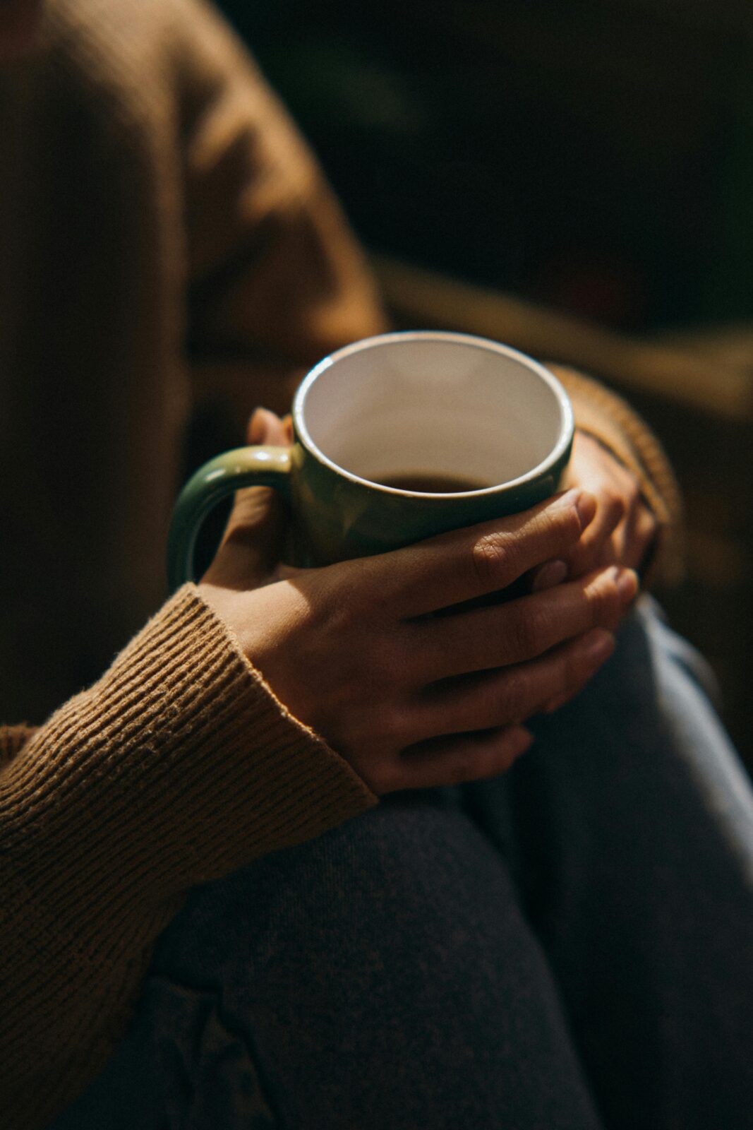 Person holding a hot drink