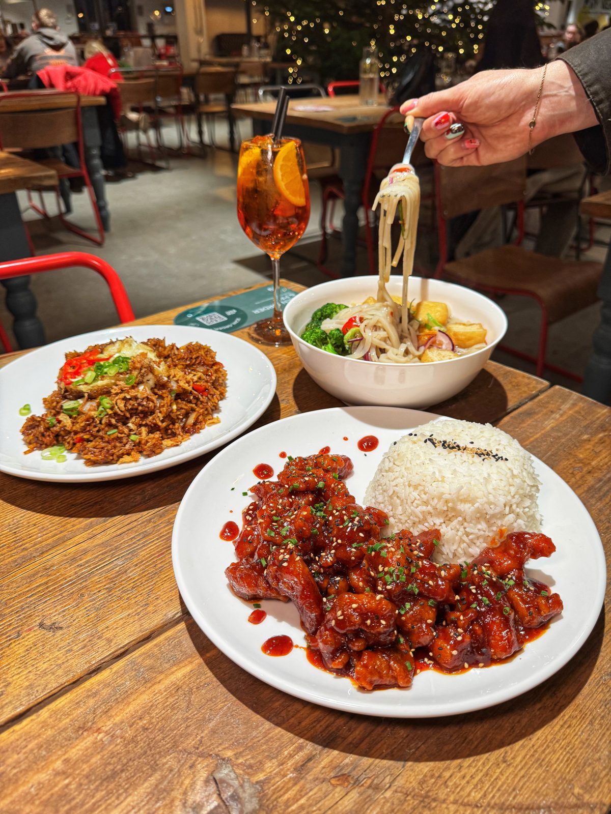 Food traders inside Glossop Market Hall include Hello Oriental