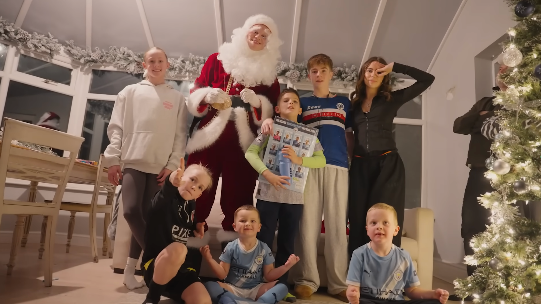Erling Haaland dresses up as Santa and gives out presents in Manchester