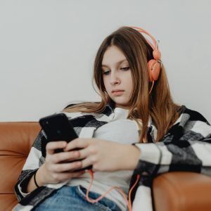 Girl listening music with headphones