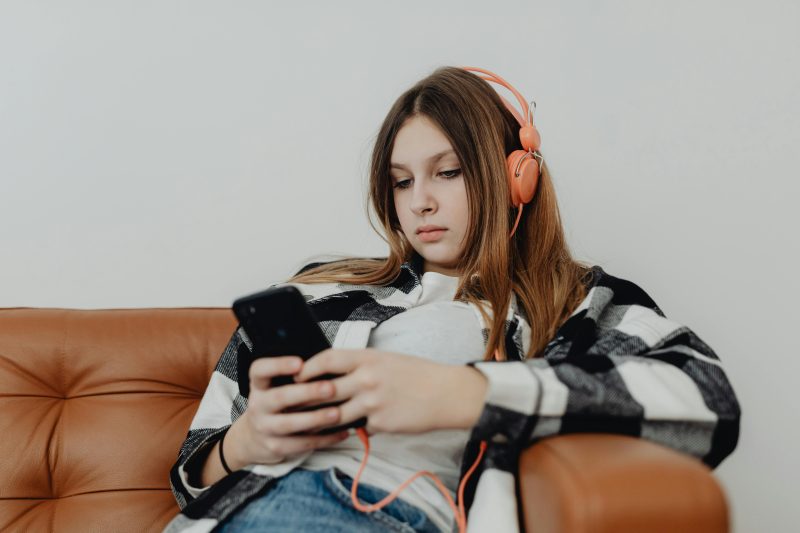 Girl listening music with headphones