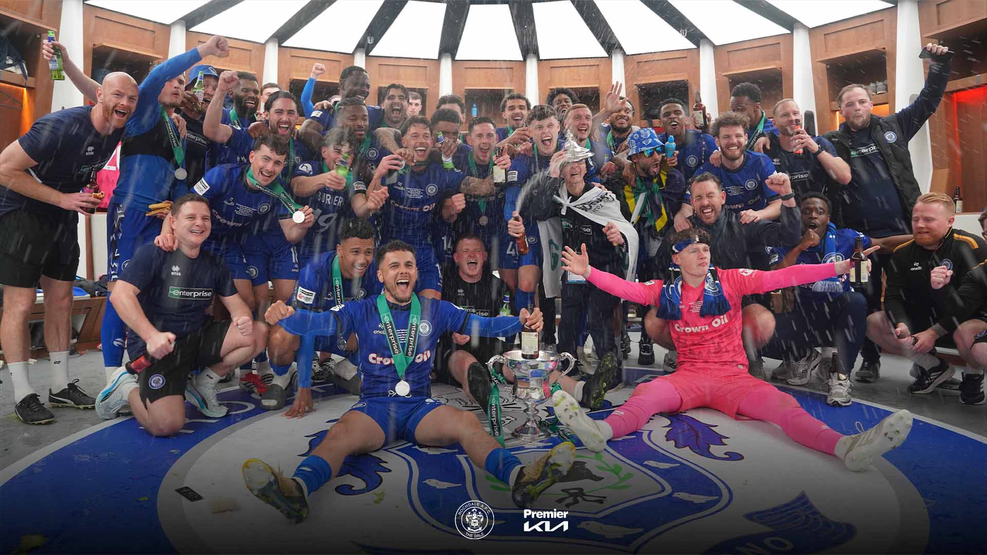Rochdale AFC players singing Olivia Dean in dressing room promotion party