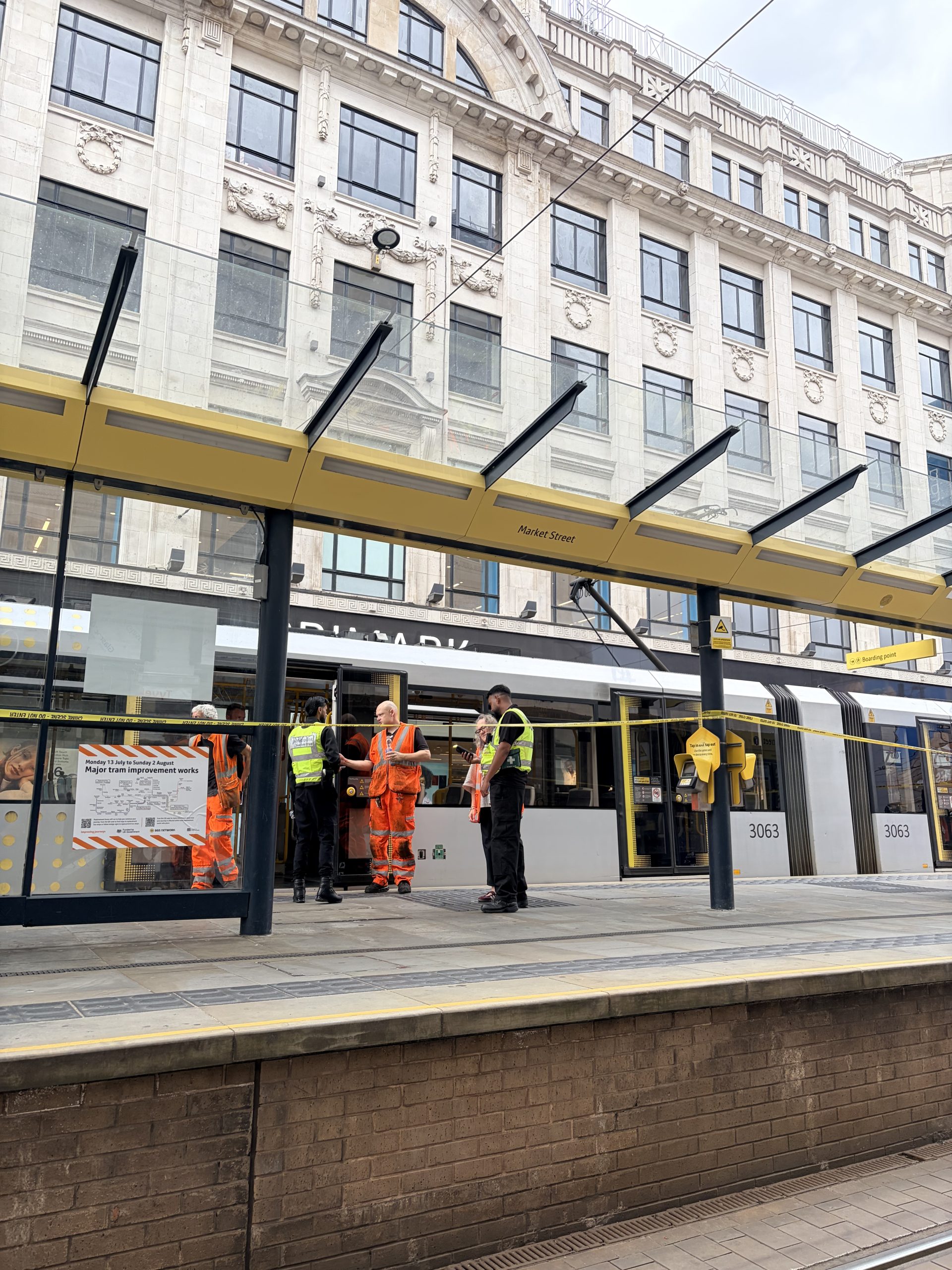 Emergency services are responding to reports of a man injured on the tram tracks in Manchester