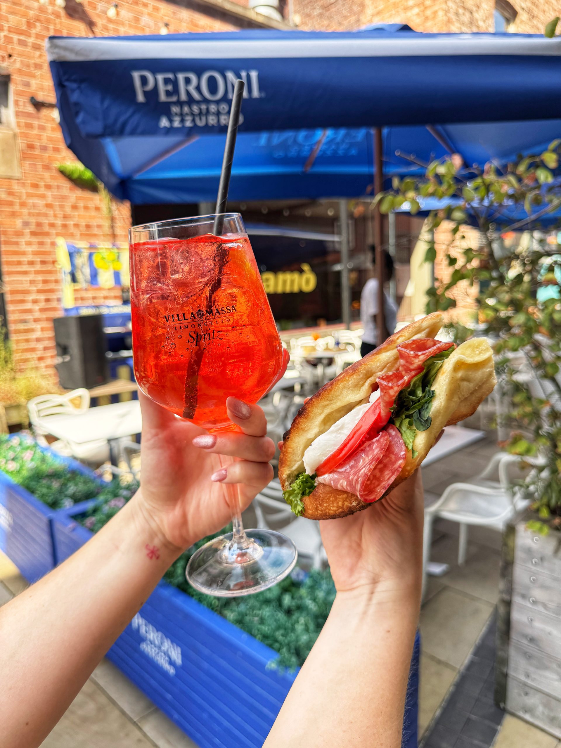 A spritz and a pizza sandwich