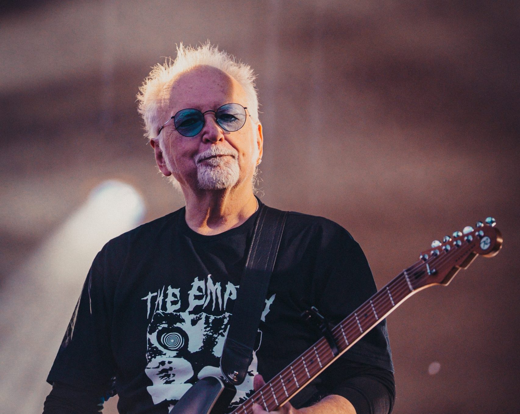 Reeves Gabrels from The Cure wearing a The Empty Page t-shirt on stage in Manchester. Credit: Aaron Law